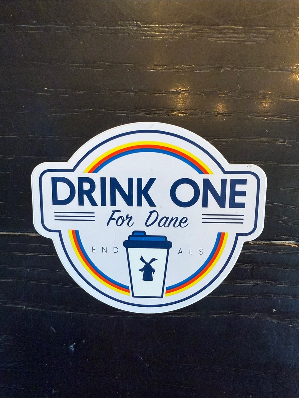Dutch Bros White Sticker with Blue Text and Rainbow Accents